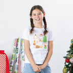 Girl wearing the Christmas Wishes Cheer Kids Tee in white, featuring a colourful festive Christmas character print on the front.
