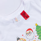 Close-up of the Christmas Wishes Cheer Kids Tee in white, showing the neckline, size label, safety warning tag and colourful festive print featuring Santa and a Christmas tree.