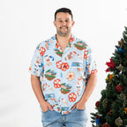 Man wearing the faded blue Christmas Wishes unisex Cheeky Santa festive shirt with blue jeans.