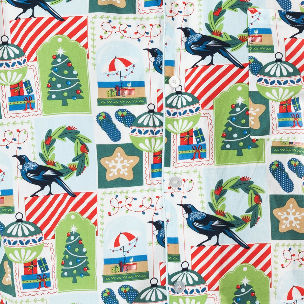 Close-up of the Christmas Wishes Tui PJ fabric featuring tūī birds, Christmas trees, wreaths, gifts, ornaments and other festive motifs.