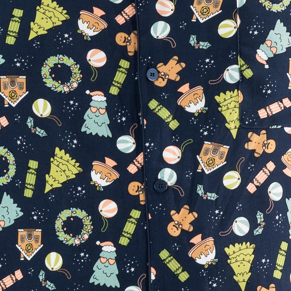 Close-up of the navy Christmas Wishes Wreath PJ fabric featuring gingerbread, Christmas trees, wreaths, crackers and ornaments.