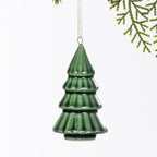 Green ceramic Christmas tree hanging decoration with a glossy tiered design and subtle ribbed detailing, suspended from a cream ribbon.