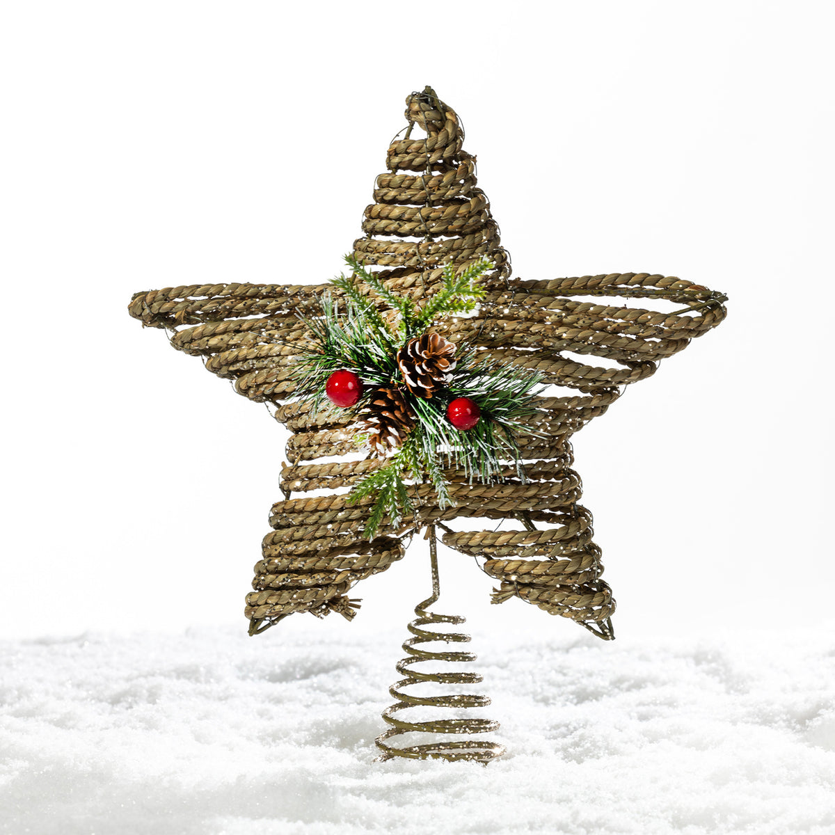 Christmas Wishes natural rattan star tree topper featuring woven detailing, festive greenery, pinecones and red berries with a spiral base.