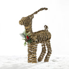 Christmas Wishes rattan standing deer decoration with a natural woven finish, glitter detailing and festive greenery with pinecones and red berries.