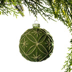Christmas Wishes Flocked Green Flower Bauble – Green flocked round Christmas bauble featuring an elegant floral-inspired pattern outlined in shimmering gold glitter and finished with a metallic hanging cap.
