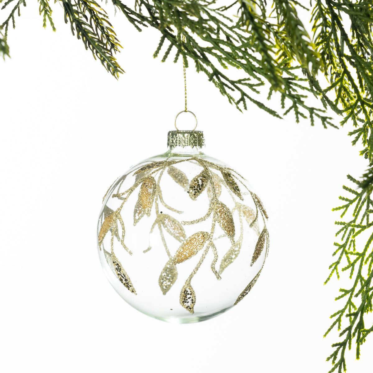 Christmas Wishes Clear Champagne Leaf Glass Bauble – Clear glass round bauble featuring delicate champagne-coloured leaf and branch motifs with shimmering glitter accents for an elegant festive finish.