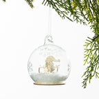 Christmas Wishes Wooden Snowman Snow Globe Bauble – Clear snow globe-style bauble featuring a wooden snowman scene with delicate snowflake detailing and faux snow for a playful festive touch.