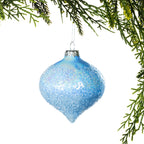 Christmas Wishes Textured Blue Onion Glass Bauble Ice Blue – Add icy elegance to your Christmas décor with this ice blue onion-shaped glass bauble. Its softly frosted surface is covered in delicate textured detailing that catches the light beautifully, creating a shimmering finish perfect for cool-toned Christmas themes.