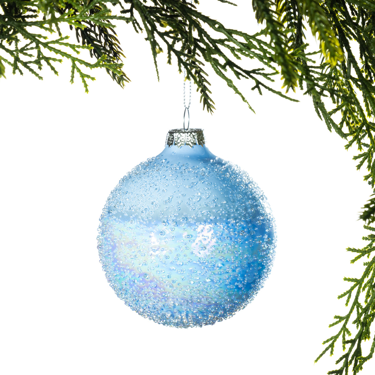 Christmas Wishes Textured Blue Glass Bauble Ice Blue – Create a fresh winter look with this round ice blue glass bauble. Finished with a softly frosted surface and textured sparkling detailing, it brings depth, shimmer and a delicate icy touch to your Christmas tree.