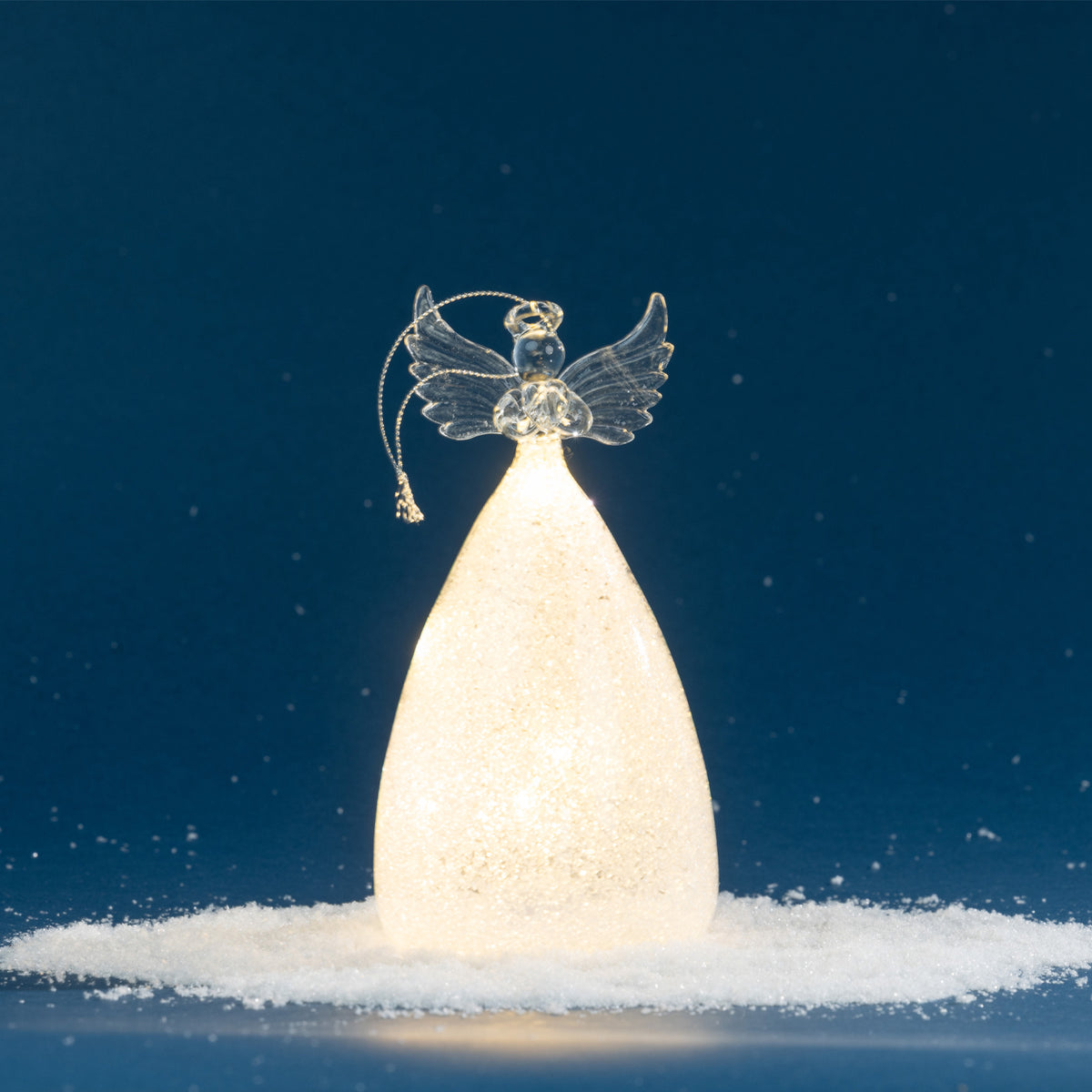 Christmas Wishes Angel Shimmer Skirt LED Decoration – Add a warm, heavenly glow to your Christmas display with this illuminated angel decoration. Featuring clear angel wings and a shimmering textured skirt, the internal LED lighting creates a soft warm light that beautifully highlights the sparkling finish. Perfect for adding an elegant festive touch to shelves, mantels or tabletop displays.