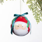 Christmas Wishes Santa sock bauble featuring festive socks rolled inside a clear ornament with a Santa face design, teal ribbon bow and hanging loop.
