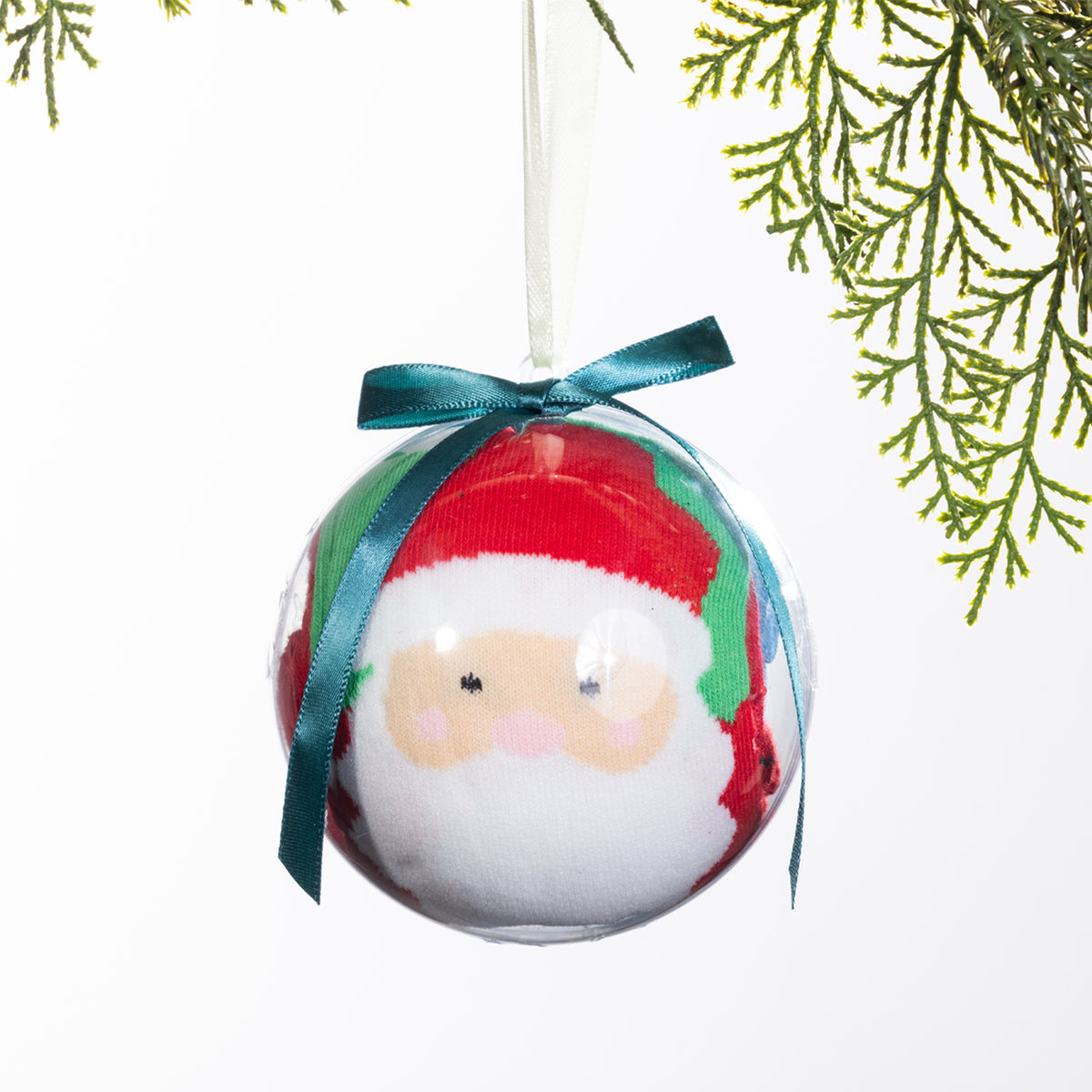 Christmas Wishes Santa sock bauble featuring festive socks rolled inside a clear ornament with a Santa face design, teal ribbon bow and hanging loop.