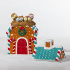 Gingerbread house cookie jar shown open and filled with gingerbread cookies, featuring candy cane details, a Christmas wreath and teal roof.