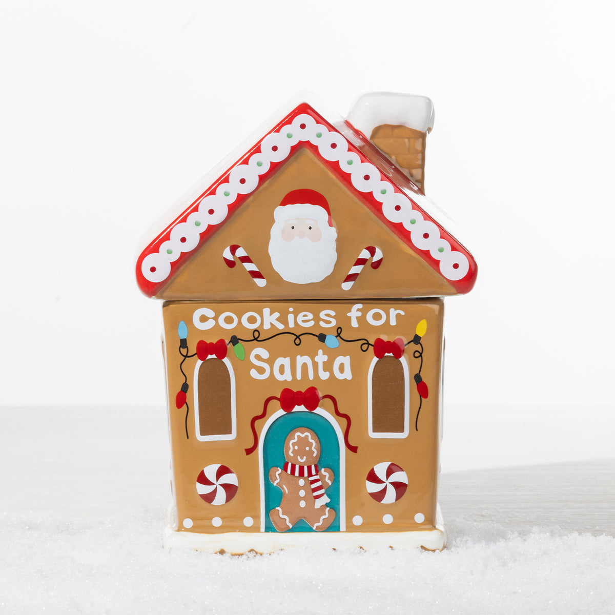 Christmas Wishes gingerbread house cookie jar featuring Santa, candy canes, colourful Christmas lights and “Cookies for Santa” lettering.