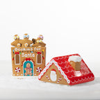 Christmas Wishes collection featuring two gingerbread house cookie jars, a Milk for Santa bottle and Christmas tree shaped cookie plate.