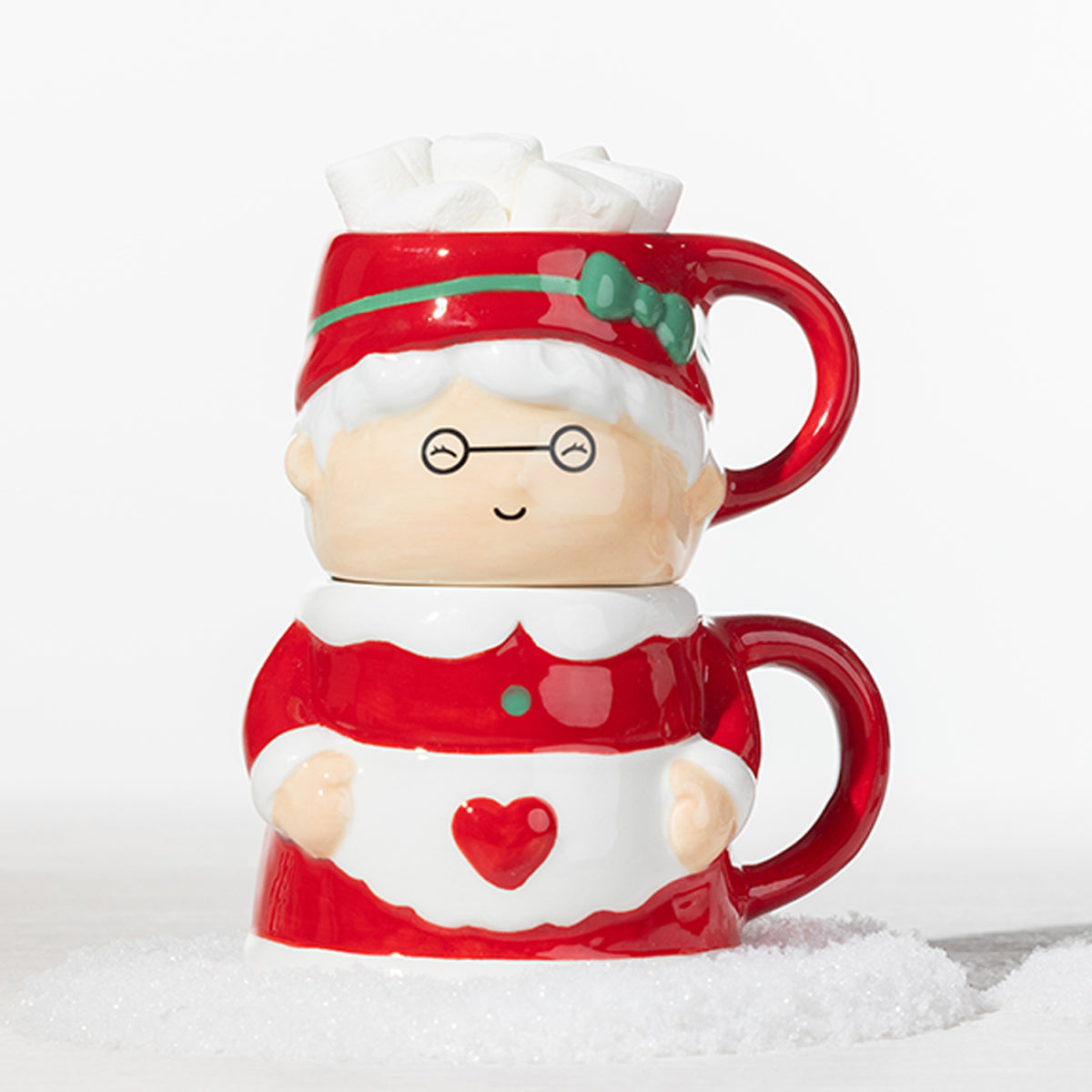 Christmas Mrs Claus mug set featuring two stackable red and white mugs, with the top mug filled with marshmallows.