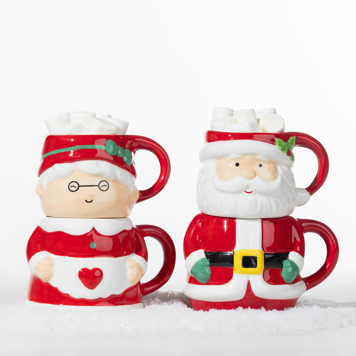 Christmas Mrs Claus and Santa Claus mug sets displayed side by side, each featuring two stackable festive character mugs filled with marshmallows.