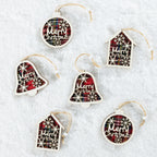 Six Christmas ornaments shaped like bells, houses, and round baubles, each with a red and black plaid pattern, white snowflakes, and 'Merry Christmas' text, displayed on a white textured background.
