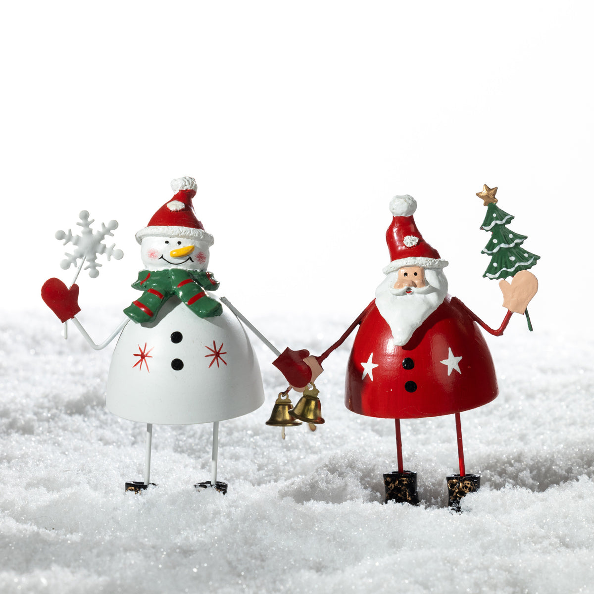 Christmas Wishes Metal Standing Santa & Snowman Décor – Coordinating metal Santa and snowman Christmas figures standing together in a snowy festive setting.
