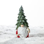 Christmas Wishes Shy Gnome Tree Hat with Bird Décor – Festive gnome decoration wearing a tall green Christmas tree hat with a long white beard, red outfit and small bird perched in one hand.