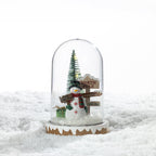 Christmas Wishes North Pole Snow Globe LED Décor – Festive North Pole snow globe-style LED decoration featuring a snowman, Christmas tree, wrapped present and directional sign beneath a clear dome.