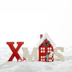 Christmas Wishes Wooden Xmas Standing Décor – Freestanding wooden “XMAS” decoration featuring a red Christmas house with faux fur roof trim, wreath detail and a festive character holding a “Peace” sign.