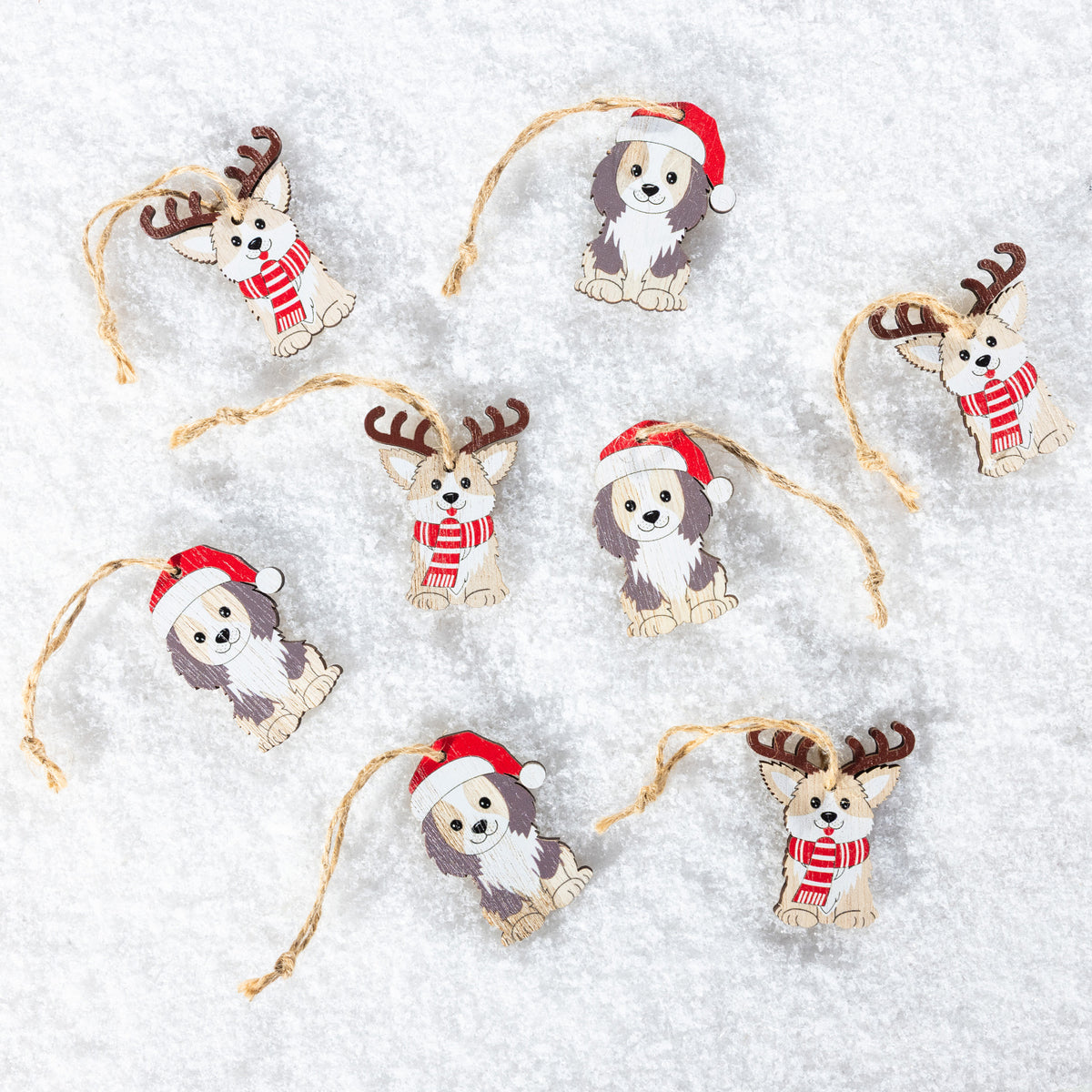 Six Christmas dog ornaments shaped like corgis, each wearing a red Santa hat and red-and-white striped sweater, hanging from natural jute twine on a white textured background.