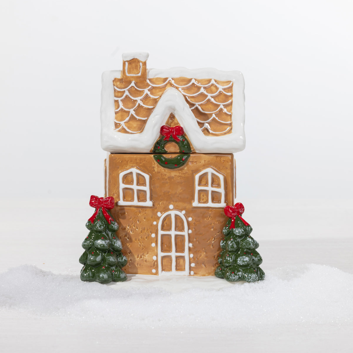 A Christmas gingerbread house cookie jar.