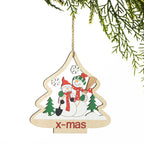 A personalized wooden Christmas tree ornament hanging from a jute string, featuring two snowmen and the text 'x-mas' on a white background with pine branches at the top.