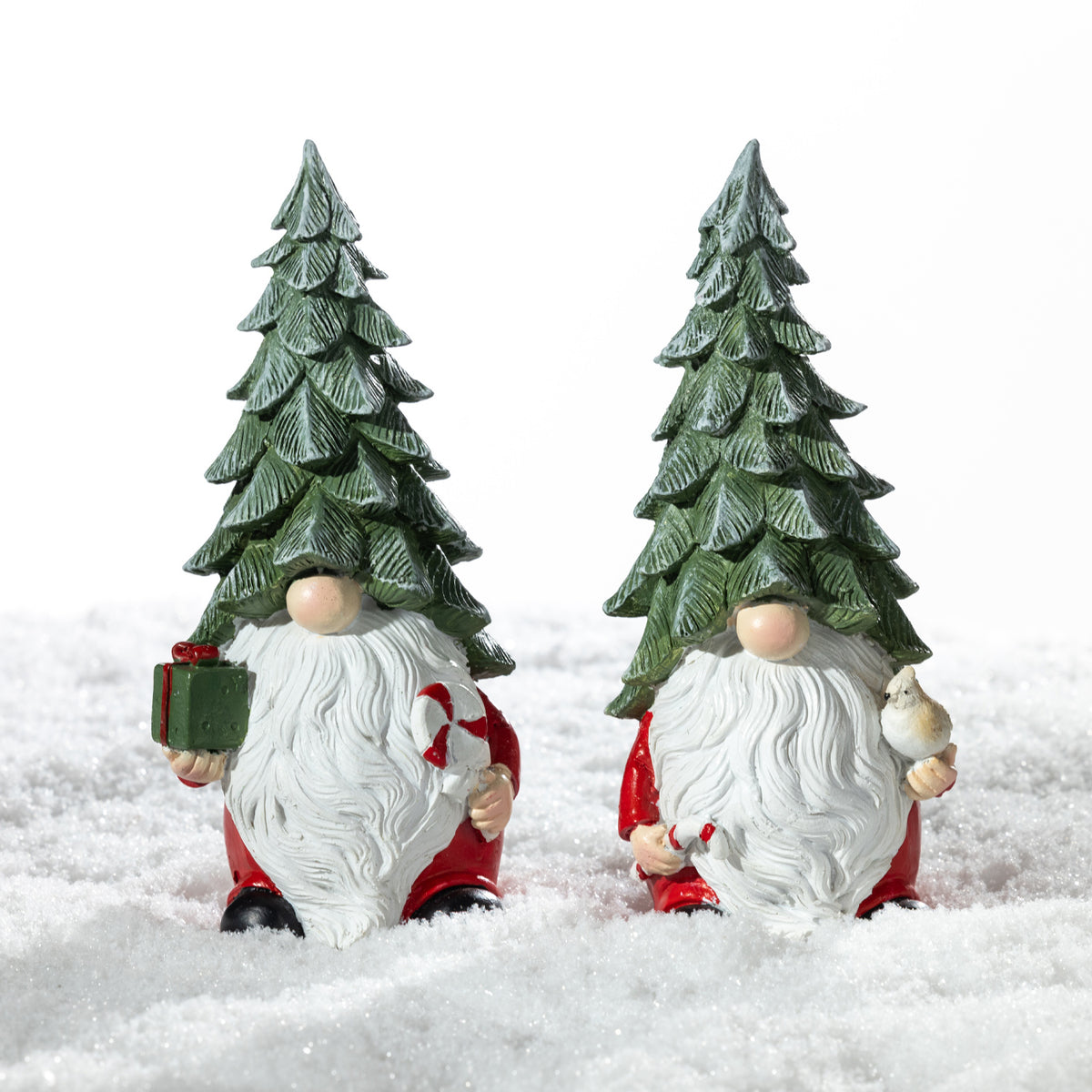 Christmas Wishes Shy Gnome Tree Hat Décor – Two coordinating Christmas gnome decorations with tall green tree hats and long white beards, one holding a present and candy cane and the other holding a small bird.