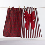 Christmas Wishes Take a Bow tea towel 2 pack with burgundy bow print towel and white striped towel featuring a large red bow.