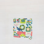 Christmas Wishes Kiwi Christmas pot holder shown individually with the colourful festive patchwork-style print.