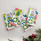 Christmas Wishes Kiwi Christmas 4 pack napkins arranged flat, featuring the colourful festive print with trees, wreaths, birds, ornaments and gifts.