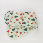 Christmas Wishes Classic Christmas Double Oven Glove laid flat, featuring green and white stripes with Christmas trees, gingerbread people, bows and Christmas puddings.