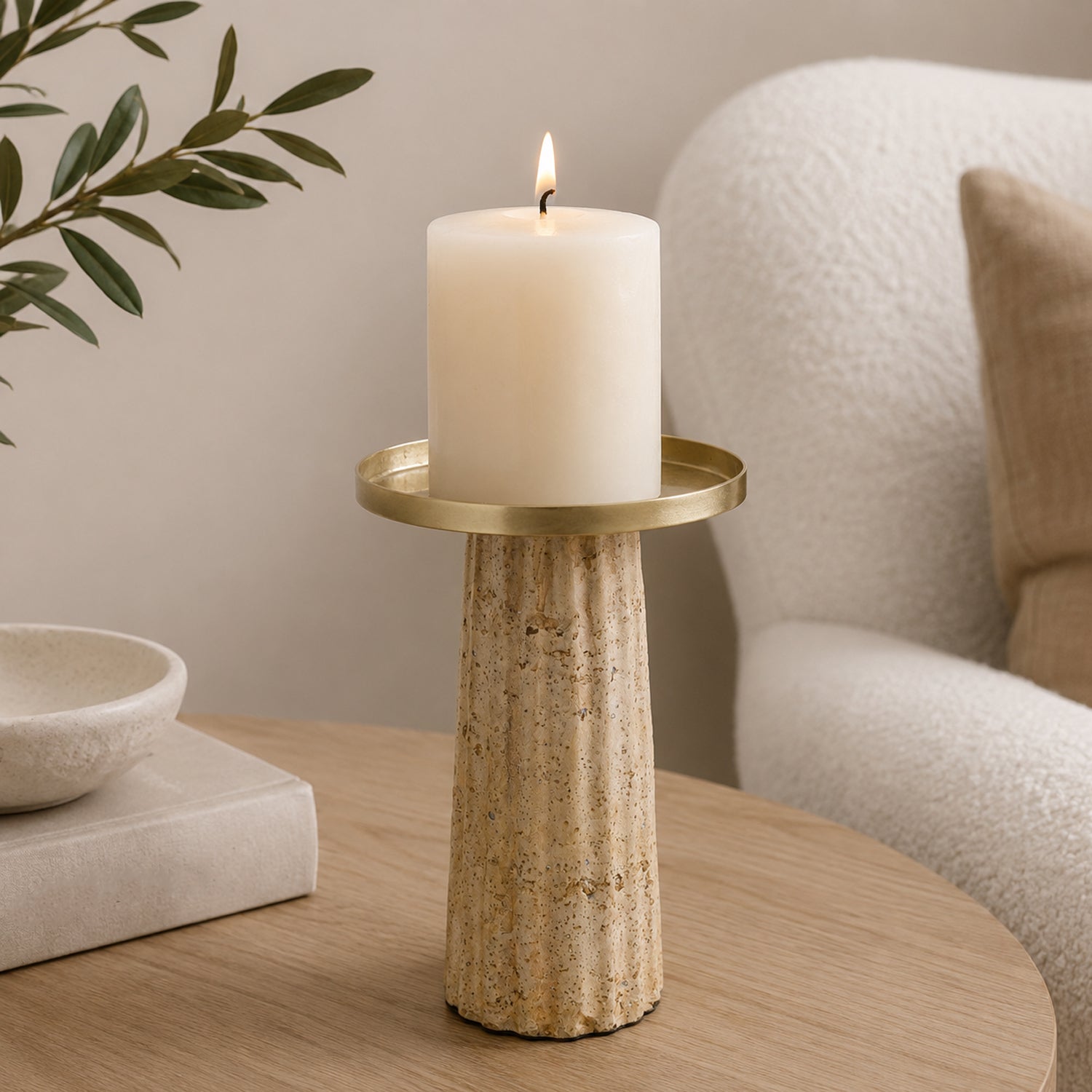 Cove Cement Candle Holder Large Natural styled on a wooden table with a lit pillar candle.