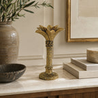 Design Republique Coconut Palm Taper Holder Gold styled on a marble tabletop with neutral décor.