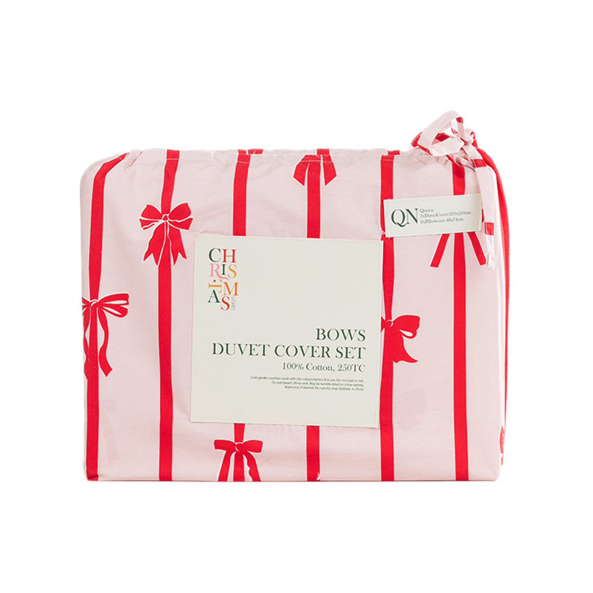 Christmas Wishes Bows Duvet Cover Set featuring red stripes and festive bows on pale pink fabric, neatly folded in matching packaging with a ribbon tie.