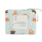 Christmas Wishes Sugar Spruce Duvet Cover Set featuring festive gingerbread men, gingerbread houses and Christmas trees on pale mint fabric, neatly folded in matching packaging with a ribbon tie.
