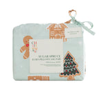 Christmas Wishes Sugar Spruce Euro Pillowcase Pair featuring festive gingerbread and Christmas tree prints on pale mint fabric, neatly folded in matching packaging with a ribbon tie.