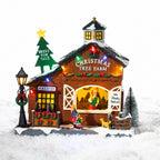 A whimsical illuminated Christmas tree farm featuring a snowy barn, colourful lights, festive wreaths and tiny shoppers choosing their perfect tree.
