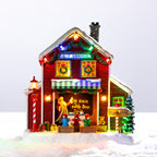 A whimsical illuminated Elf School featuring colourful Christmas lights, tiny elves, festive gifts and playful North Pole details in a snowy setting.