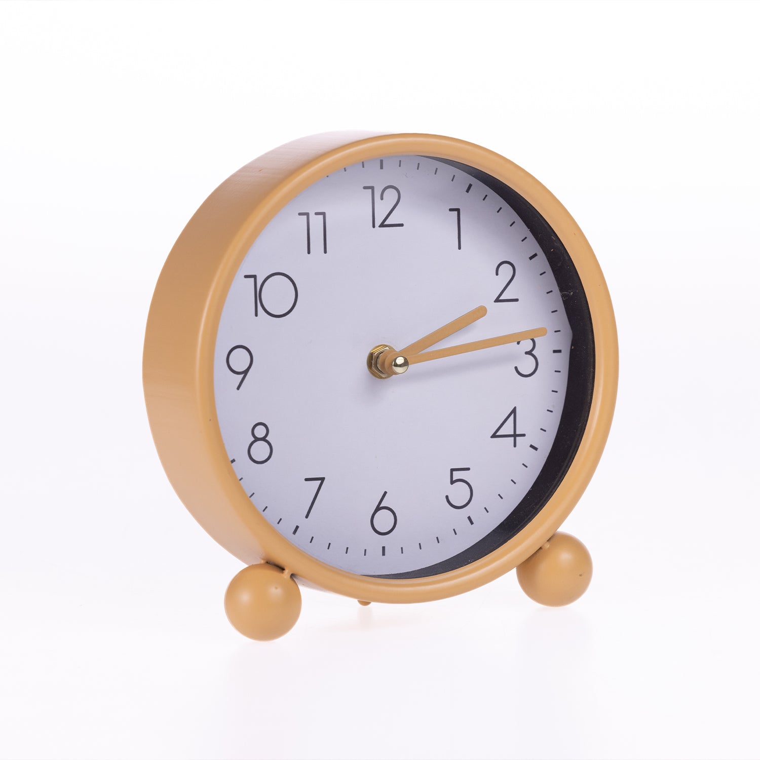 A round analog table clock with a matte gold metal frame, two small feet, and a white face with black numerals and gold hands, shown on a white background.
