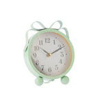Mint green round table clock shown at an angle, featuring a white clock face, black numerals, ribbon-style loops and rounded feet.