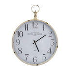 A vintage-style round wall clock with a distressed white face, black Arabic numerals, black hands, and a gold-toned metal frame and hanging ring, shown on a plain white background.