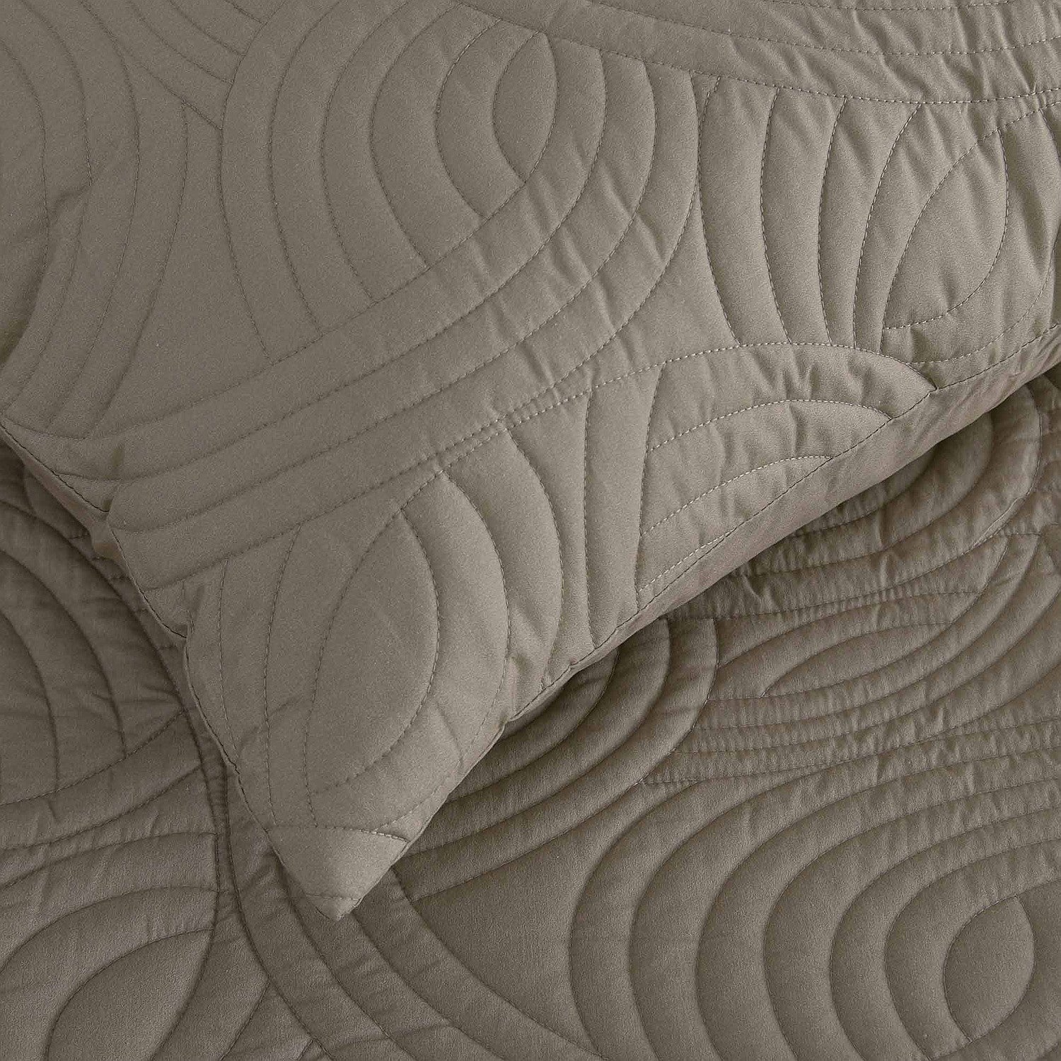 Mushroom colour quilted coverlet close-up showing textured stitched pattern and matching pillowcase.