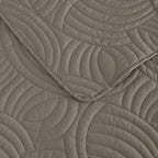 Mushroom colour quilted coverlet close-up showing textured stitched pattern 