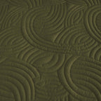 Olive green quilted coverlet close-up showing textured stitched pattern 