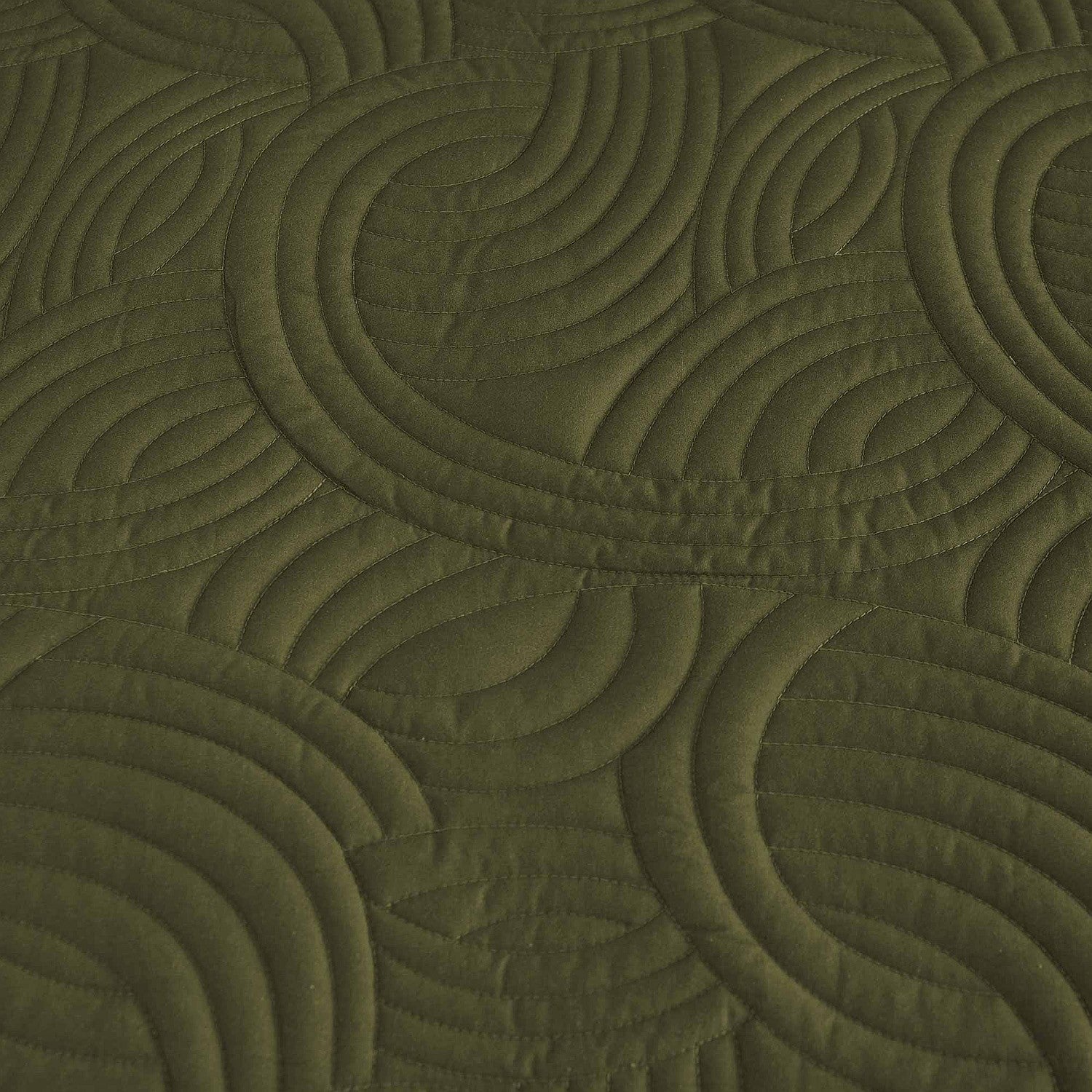Olive green quilted coverlet close-up showing textured stitched pattern 