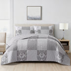 Home Co. Tara Patchwork Coverlet Set in Grey Beige, styled on a bed with coordinating patchwork pillow shams in a bright neutral bedroom.
