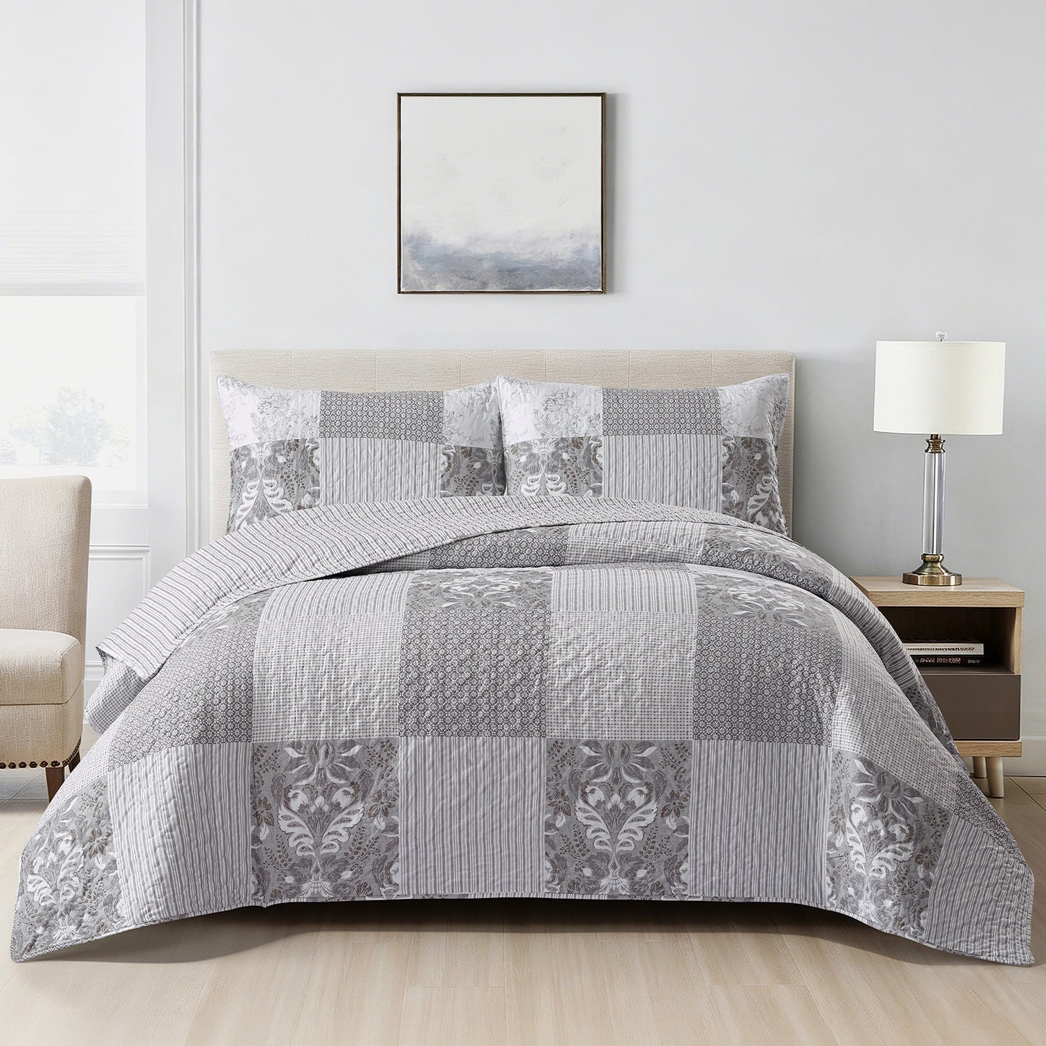 Home Co. Tara Patchwork Coverlet Set in Grey Beige, styled on a bed with coordinating patchwork pillow shams in a bright neutral bedroom.